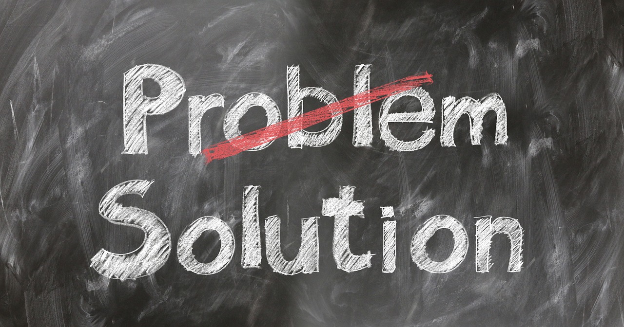The word problem on chalkboard crossed out on top
          with solution on the bottom not crossed out.